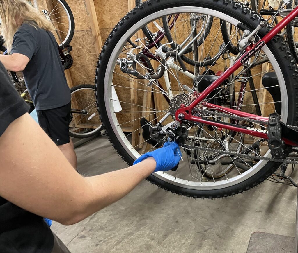 hand working on bike